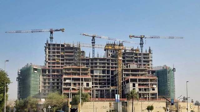 The Rixos Hotel building under construction, with tower cranes above the structure